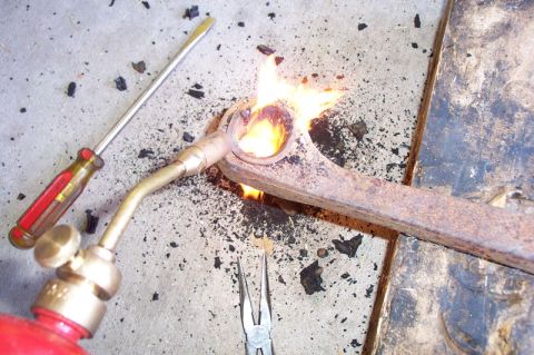 1968 Ford F-100 - Step 3--Use one of those $10 torches that you find at the parts stores to burn out the rest of the bushing. Burn it some, the use pliers an…