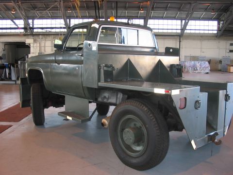 1988 Ford Bronco - This utilitarian truck features a custom flatbed with integrated toolboxes and a heavy-duty rear end.