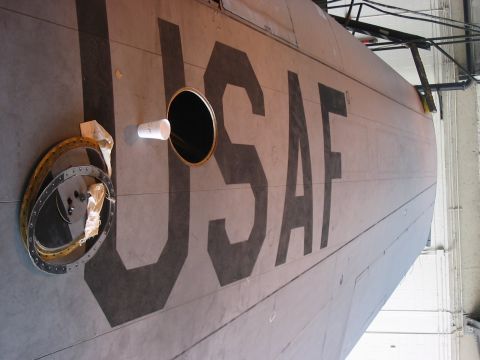 1988 Ford Bronco - The side of an aircraft fuselage displays large "USAF" lettering, with a circular opening and a detached ring nearby.
