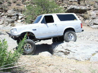 1992 Ford Bronco - This Ford Bronco is navigating a rocky, off-road trail.