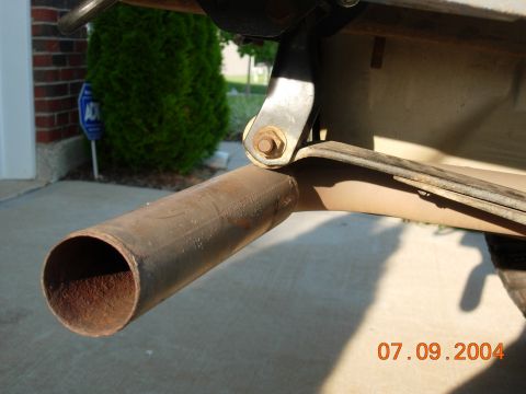 1995 Ford Bronco - Close-up view of a vehicle's exhaust pipe and suspension components, dated July 9, 2004.