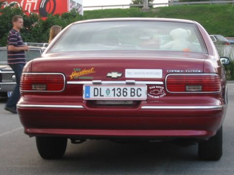 1992 Ford Crown Victoria - This Chevrolet Caprice Classic sedan has a "Heartbeat of America" sticker and other decals on its rear.