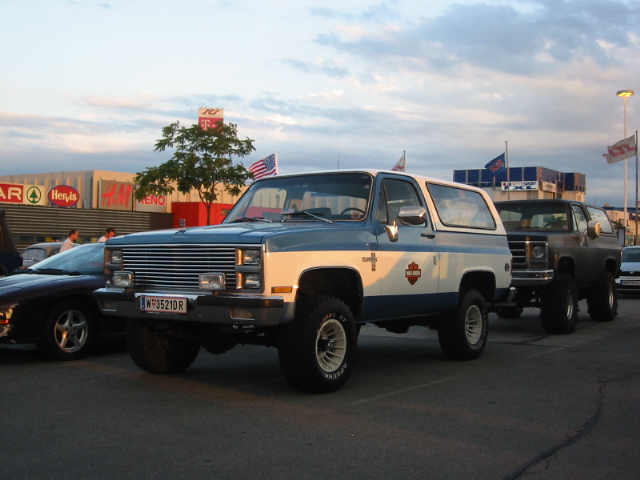 Two-tone blue and white Chevy K5 Blazer parked next to another SUV