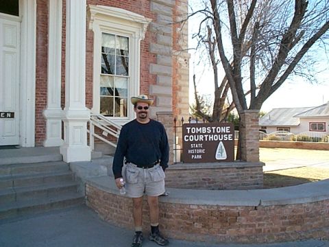 1994 Ford Bronco - A man poses for a photo in front of the historic Tombstone Courthouse.