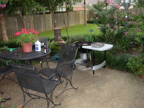 1995 Ford Bronco - A backyard patio scene with outdoor furniture and a grill is set up for a cookout.
