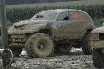 1989 Ford Bronco - This heavily modified SUV is covered in mud, suggesting it was used for off-roading or mud bogging.