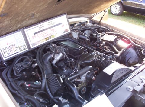 1991 Ford Crown Victoria LTD - Engine bay details with a sign indicating '85 Lincoln Town Car' and 'Mustang GT'.