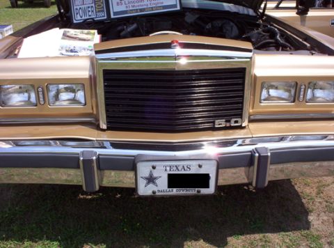 1991 Ford Crown Victoria LTD - Gold 1985 Lincoln Town Car front end with black grille and 5.0 badge, Texas license plate.