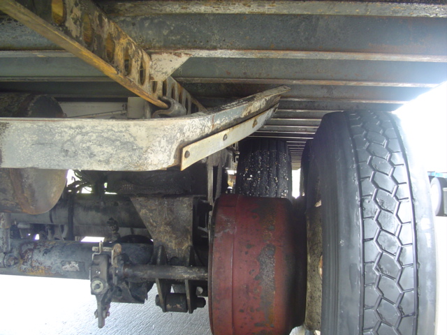 Underside view of a trailer's suspension and tires