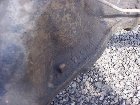 1988 Ford Bronco - Close-up of a cast iron part showing stamped numbers '120072' against a gravel background.