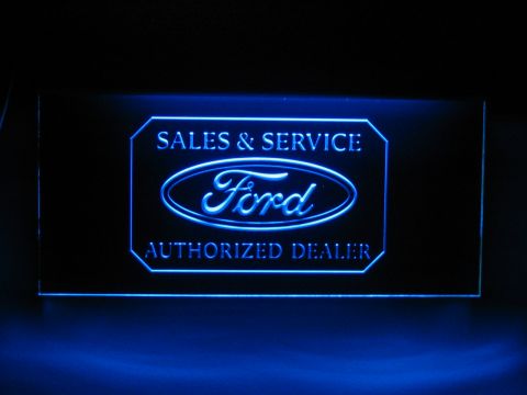 1988 Ford Bronco - A glowing Ford authorized dealer sign is illuminated with blue light.