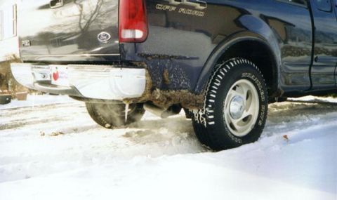 2000 Ford F-150 - This Ford F-150, likely from the late 1990s, is shown in a snowy environment with icicles forming on its rear bumper.