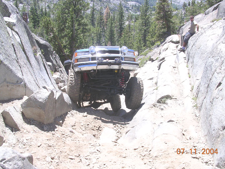 Off-road truck navigating a rocky trail