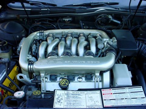 1989 Ford Taurus - Close-up of a Ford SHO 24 valve DOHC engine, showing the intake manifold and underhood sticker.