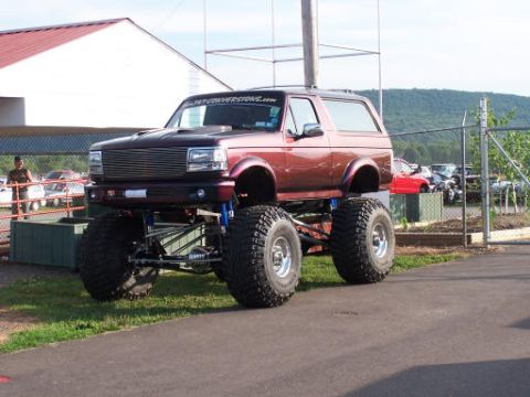 1994 Ford Bronco - This heavily modified Ford Bronco features a significant lift kit and oversized tires.