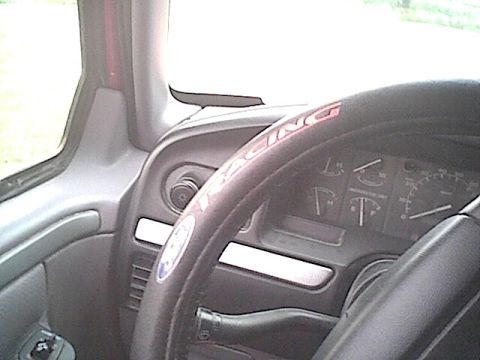 1994 Ford Bronco - The dashboard and steering wheel of a 1994 Ford Bronco are visible from the driver's perspective.
