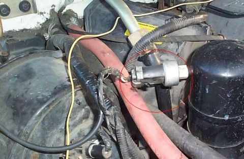 1992 Ford Bronco - A close-up view of a component within a vehicle's engine bay, highlighted by a red circle.