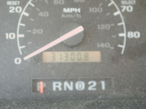 1994 Ford Bronco - Interior view of a vehicle's dashboard showing the speedometer and odometer.