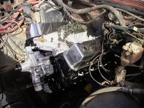 1985 Ford Bronco - Engine installation in progress, Ford valve covers and a new water pump.