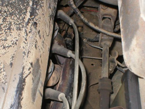 1978 Ford Bronco - Detail shot of spark plug wires and engine components, showing wear and tear.