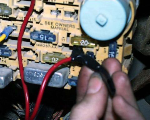 1988 Ford E250 - Fuse box with wiring and fuses, some labeled with amperage ratings.