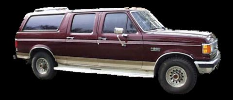 1988 Ford C-350 (Centurion Conversions) - This 1988 Ford C-350 Centurion Conversions features an extended cab and a camper shell, presented in a three-quarter front view.