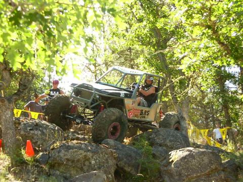 1990 Ford Bronco - Custom off-road buggy tackles a challenging rocky obstacle course.