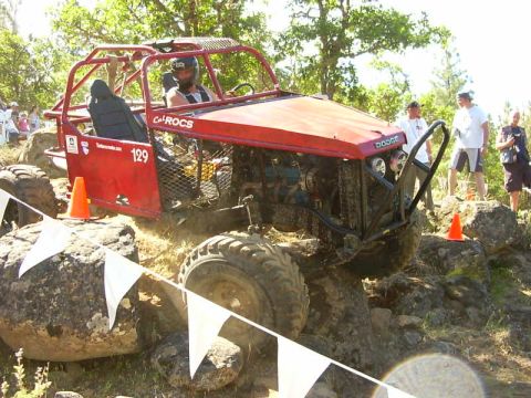 1990 Ford Bronco - Custom off-road buggy with Dodge badging tackles a challenging rocky course.