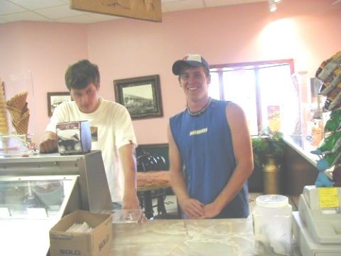 1997 Ford Taurus - Two employees stand behind the counter of an ice cream shop, with cones and snacks visible.