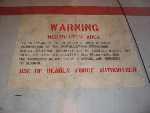 1988 Ford Bronco - A stenciled warning sign on the floor indicates a restricted area where deadly force is authorized.
