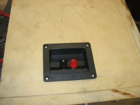 1988 Ford Bronco - A speaker binding post is shown mounted on a wooden panel.