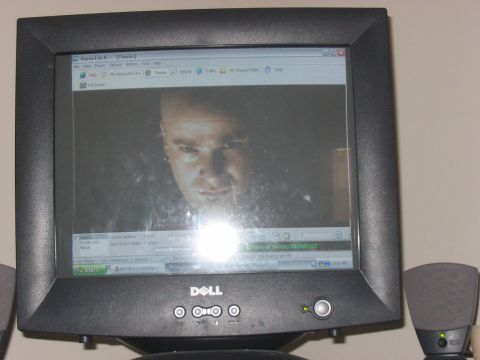 1988 Ford Bronco - A computer monitor displays a movie scene with a man's face filling the screen.
