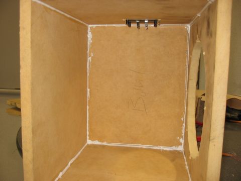 1988 Ford Bronco - This is the inside of a custom-built speaker enclosure, showing the raw wood and sealant.