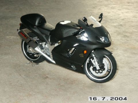 1998 Mercury Sable - Black sport motorcycle with dual headlights and exhaust pipe.