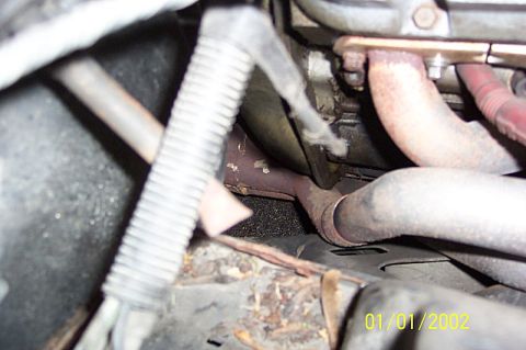 1978 Ford Bronco - This image shows a close-up view of the exhaust manifold and pipes, part of a vehicle's engine system.
