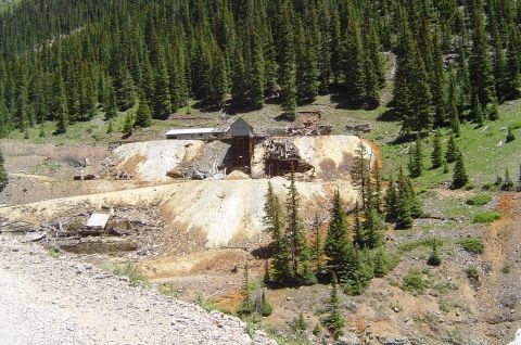 1993 Ford Bronco - Old mine buildings are visible on a steep, forested slope.