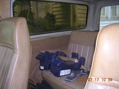 1984 Chevrolet Blazer - Vehicle interior with tan seats and two blue car seat bases visible on the rear seat.