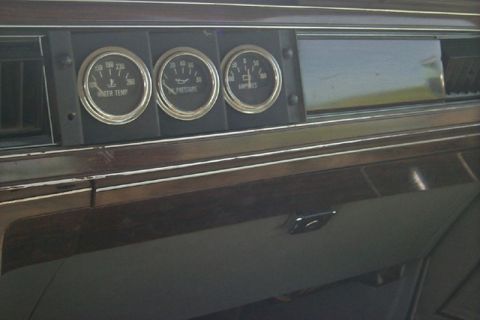 1991 Ford Crown Victoria LTD - Interior view of a dashboard showing water temperature, oil pressure, and amperage gauges.
