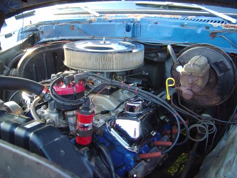 1986 Ford Bronco - Close-up view of a V8 engine, a chrome air cleaner and valve covers.