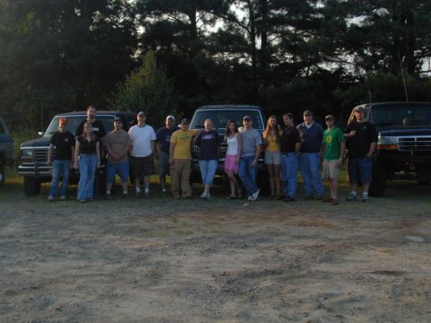 1988 Ford Bronco - A group poses with their Ford trucks and SUVs, including a Bronco.