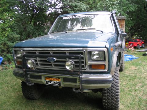 1986 Ford Bronco - This 1986 Ford Bronco features a snorkel and off-road lights, suggesting it's ready for adventure.