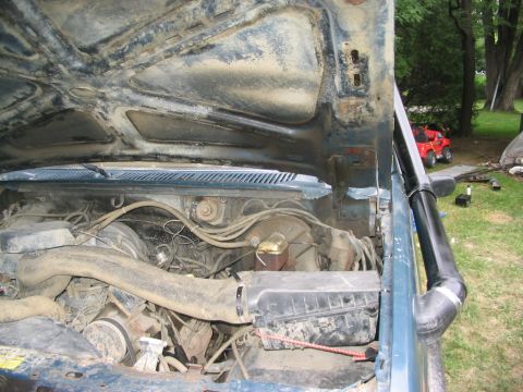 1986 Ford Bronco - Engine bay of a 1986 Ford Bronco, a snorkel intake.