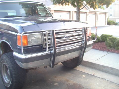 1988 Ford Bronco - This Ford truck features a prominent chrome brush guard, a common accessory for off-road vehicles.