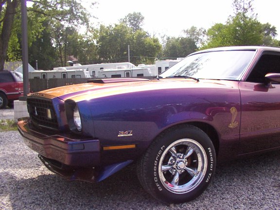 Purple and orange 1978 Ford Mustang II with a cobra emblem and 347 badge
