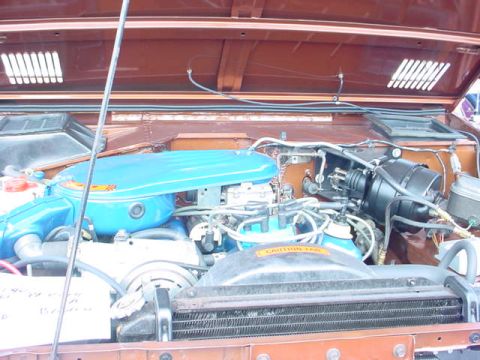 1979 Ford Bronco - The engine bay of a 1979 Ford Bronco is shown with various components and wiring.
