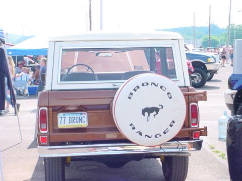 1979 Ford Bronco - Rear view of a 1977 Ford Bronco, identifiable by the license plate and spare tire cover.