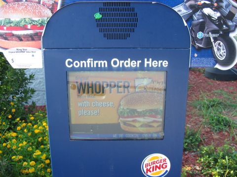 1988 Ford Bronco - Burger King drive-thru order confirmation screen displays a Whopper meal advertisement.