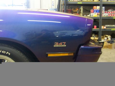 1978 Ford Mustang II - Close view of a car's front fender and bumper, showing a '347' emblem.