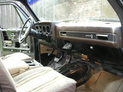 1984 Chevrolet Blazer - The interior of a Chevrolet truck, likely from the 1980s, shows the dashboard and seating area.