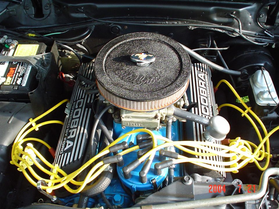 Engine bay with Cobra valve covers and yellow spark plug wires